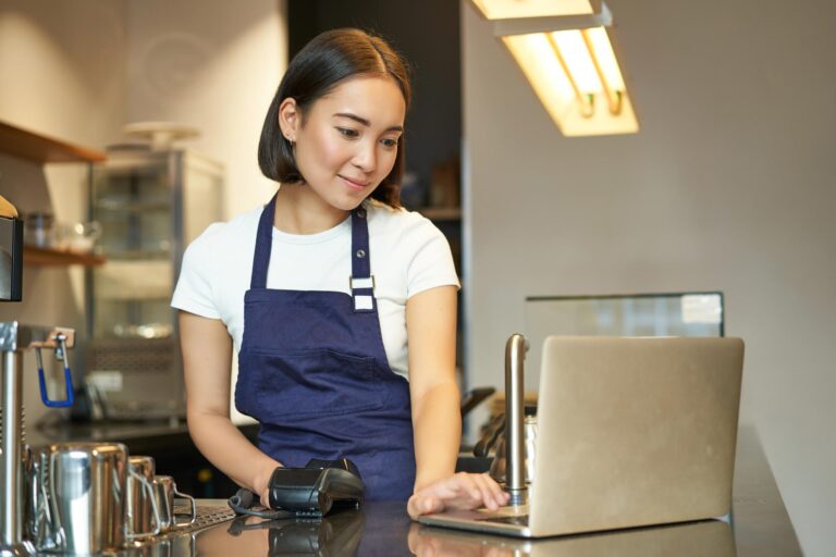 smiling-asian-girl-barista-working-in-cafe-servi-2023-01-11-22-29-44-utc.jpg